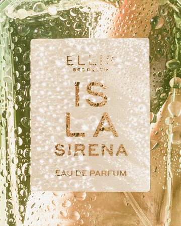 Closeup of ISLA SIRENA Eau de Parfum 50ml covered in water droplets