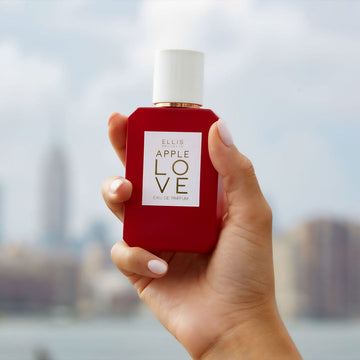IMAGE 3: MODEL HOLDING APPLE LOVE BOTTLE