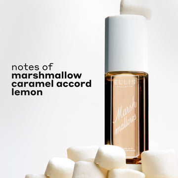 MARSHMALLOWS Perfume Mist 240ml with a marshmallow sitting on the cap, sitting on a pile of marshmallows with black text that reads 