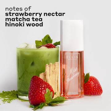 MISS STRAWBERRY Perfume Mist 90ml next to matcha powder, two strawberries, hinoki wood, and a glass cup filled with ice, matcha tea, and a strawberry with black text that reads 