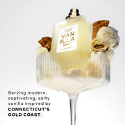 Vanilla Salt 50ml Eau De Parfum without cap in glass with vanilla ice cream, pieces of ice cream cone, and gold ring, on white background, above black text that reads 