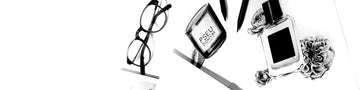 Pencil drawing of glasses, Pseudonym candle with fig, and 50ml Eau De Parfum bottle with flowers, next to blank pieces of paper and pencils, on white background. 