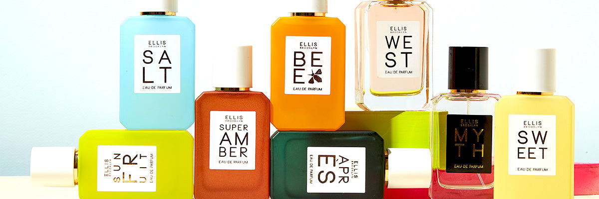 Salt 50ml Eau De Parfum, Sun Fruit 50ml Eau De Parfum, Super Amber 50ml Eau De Parfum, Apres 50ml Eau De Parfum, Bee 50ml Eau De Parum, West 50ml Eau De Parfum, Myth 50ml Eau De Parfum, and Sweet 50ml Eau De Parfum on white table with green and red blocks, on white background.