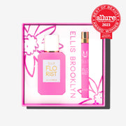 Boîte cadeau Florist Eau De Parfum montrant le Florist 50ml Eau De Parfum et le Florist 10ml Eau De Parfum Vaporisateur de voyage sur fond blanc avec le badge rouge Allure The Beauty Export Best of Beauty Winner Clean Beauty 2023.