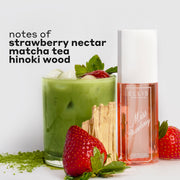 MISS STRAWBERRY Perfume Mist 90ml next to matcha powder, two strawberries, hinoki wood, and a glass cup filled with ice, matcha tea, and a strawberry with black text that reads 