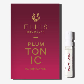 PLUM TONIC 1.5ml Eau De Parfum Vial next to red ombre PLUM TONIC Eau De Parfum vial holder card on white background. | english_image
