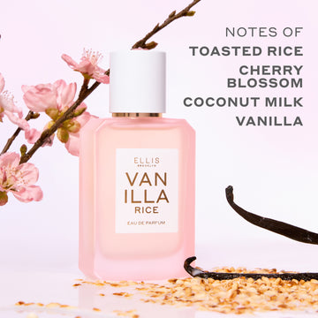 VANILLA RICE Eau de Parfum 50ml next to toasted rice, vanilla beans, and pink sakura blossoms on a pink background with gray text that reads 
